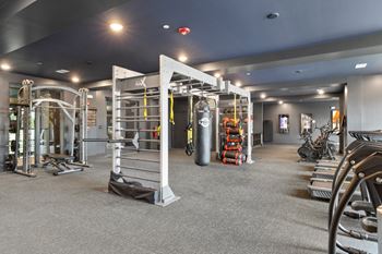 Cardio and strength training fitness center with eschelon and peloton bikes and fitness mirrors